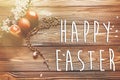 Happy easter text on stylish easter eggs and wooden rosary with Royalty Free Stock Photo