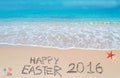 Happy easter 2016 on a tropical beach under clouds Royalty Free Stock Photo