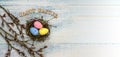 Happy Easter. Willow twigs. Holy Easter. Blue turquoise background. Easter eggs in the nest Royalty Free Stock Photo