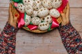 Happy Easter. Woman Hands holding basket with hand made decorated Easter eggs.Spring decoration background. Festive tradition for Royalty Free Stock Photo