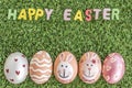 Happy easter word spelling on grass background