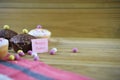 Happy Easter words with chocolate mini cakes and Easter egg decorations