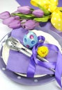 Happy Easter yellow and purple mauve lilac theme Easter table place setting - close up