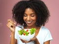 Happy, eating and woman with salad for wellness, fresh and detox lunch meal with vegetables. Smile, healthy and female Royalty Free Stock Photo