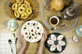 Happy Eid Al fitr Concept, hand hold an Oriental Algerian sweet cookies with apricot jam