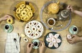 Happy Eid Al fitr Concept, women`s enjoying breakfast with friends. Top view of group of muslim people having coffee time together