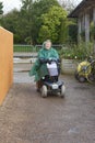 Harlow Carr, England-16th April 2016: An elderly Lady on a Mobility Scooter at a Garden Centre.
