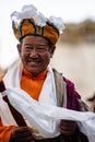 Happy Elder monk in traditional outfir at the Tibetan Buddhist Tiji Festival in Nepal