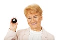 Happy elderly business woman holding eight billard-ball Royalty Free Stock Photo