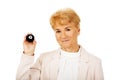 Happy elderly business woman holding eight billard-ball Royalty Free Stock Photo