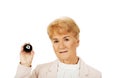 Happy elderly business woman holding eight billard-ball