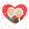 Happy elderly couple behind heart shaped frame