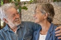 Happy elderly couple embracing looking into each other eyes. Two senior grandparents enjoying stay together Royalty Free Stock Photo