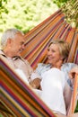 Happy elderly couple in hammock