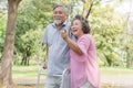 Happy elderly couple with lifestyle after retiree concept. Lovely asian seniors couple walking exercise in the park in the morning Royalty Free Stock Photo