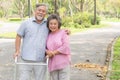 Happy elderly couple with lifestyle after retiree concept. Lovely asian seniors couple walking exercise in the park in the morning Royalty Free Stock Photo