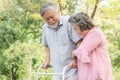 Happy elderly couple with lifestyle after retiree concept. Lovely asian seniors couple walking exercise in the park in the morning Royalty Free Stock Photo