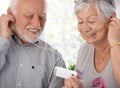 Happy elderly couple with mp3 player Royalty Free Stock Photo