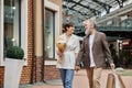 happy elderly couple during shopping, flowers Royalty Free Stock Photo