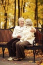 Portrait of elderly couple in autumn park Royalty Free Stock Photo