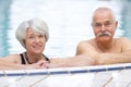 Happy elderly couple in swimming pool Royalty Free Stock Photo