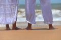 Happy elderly couple walking on tropical beach Royalty Free Stock Photo