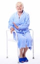 Happy elderly lady on shower seat Royalty Free Stock Photo