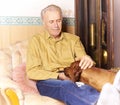 Happy elderly man with his dog Royalty Free Stock Photo