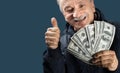 Happy elderly man showing fan of money Royalty Free Stock Photo