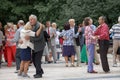 Moscow, Russia, August 14, 2016: happy elderly men and elderly women dance with each other on the dance floor under music in Sokol