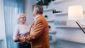 Happy elderly retired couple dancing at home. Birthday, valentines day or anniversary concept Royalty Free Stock Photo