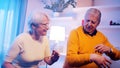 Happy elderly retired couple dancing at home. Birthday, valentines day or anniversary concept Royalty Free Stock Photo