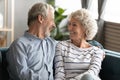 Smiling mature couple relax at home hugging Royalty Free Stock Photo