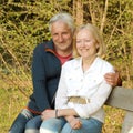 Happy elderly seniors couple in park. Portrait of a beautiful elderly couple outdoors Royalty Free Stock Photo