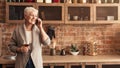 Happy Elderly Woman Holding Glass Of Wine And Talking On Cellphone Royalty Free Stock Photo