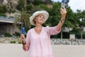 Mature woman taking selfie on beach Royalty Free Stock Photo