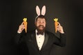 Happy elegant businessman wear rabbit ears. Rabbit costume party. Bunny or hare. Easter symbol. Holiday celebration