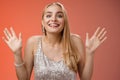 Happy elegant dreamy glamour young blond woman raising hands delight joyfully smiling camera glad see friends comming Royalty Free Stock Photo