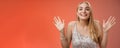 Happy elegant dreamy glamour young blond woman raising hands delight joyfully smiling camera glad see friends comming Royalty Free Stock Photo