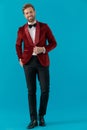 Happy elegant fashion man wearing red velvet tuxedo Royalty Free Stock Photo