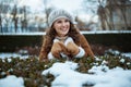 Happy elegant female outdoors in city park in winter