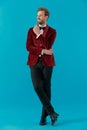 Happy elegant man wearing red velvet tuxedo and smiling Royalty Free Stock Photo