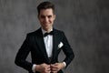 Happy elegant man wearing tuxedo and smiling Royalty Free Stock Photo