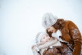happy elegant mother and daughter laying in snow Royalty Free Stock Photo