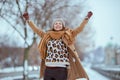 happy elegant woman in brown hat and scarf in camel coat Royalty Free Stock Photo