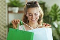 Happy elegant woman shopper in sunglasses with shopping bags Royalty Free Stock Photo