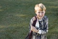 Happy elementary school boy with bookbag Royalty Free Stock Photo