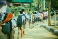 Happy students having fun on street after school