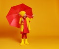 happy emotional cheerful child girl laughing with red umbrella on colored yellow background