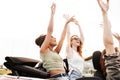 Happy emotional four young women friends sitting in car Royalty Free Stock Photo